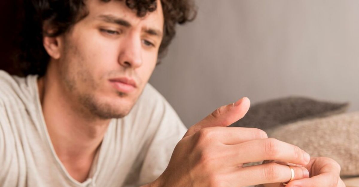 Man Wears a Ring on Necklace